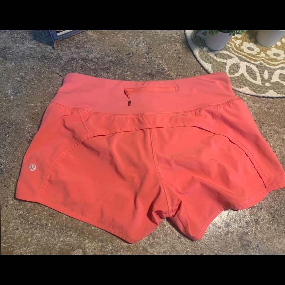 Lululemon Athletica Speed Short. Size 4 Color is Grapefruit. Excellent condition